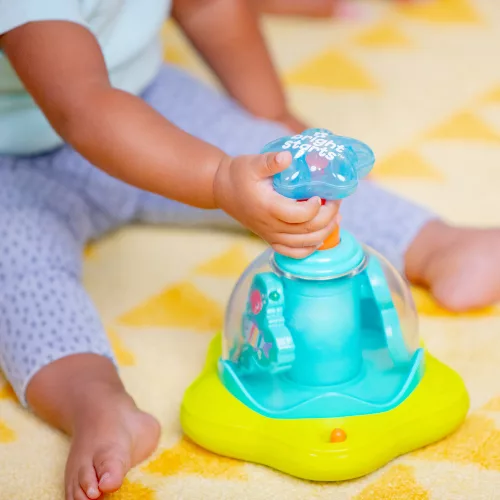 BRIGHT STARTS Zenélő, világító játék Press & Glow Spinner 6hó+