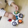 BABY EINSTEIN Érzékszervi játék Curiosity Clutch™ 3hó+
