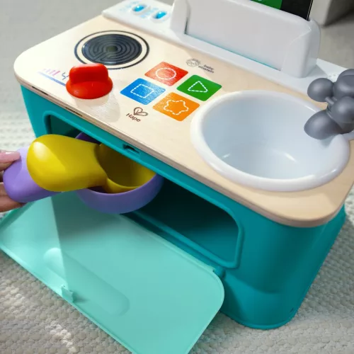 BABY EINSTEIN Zenei Játék Magic Touch Kitchen™ Pretend to Cook HAPE 9hó+