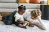 BABY EINSTEIN Zenélő játék Take Along Tunes™ 3hó+